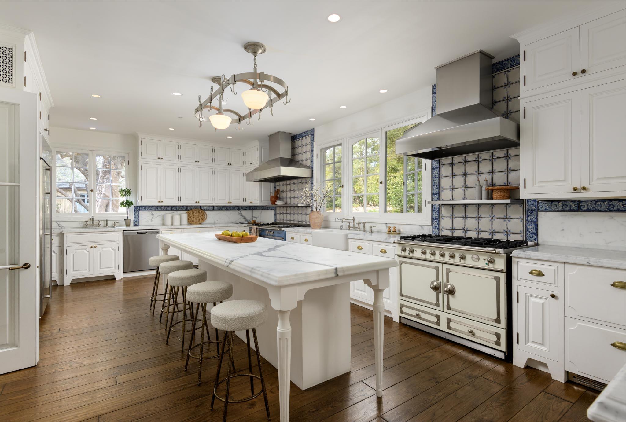 771 Garden Lane Montecito, CA 93108 - Photo 17 of 44 a kitchen with stainless steel appliances a dining table chairs sink and stove top oven