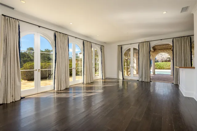 a view of an entryway with wooden floor
