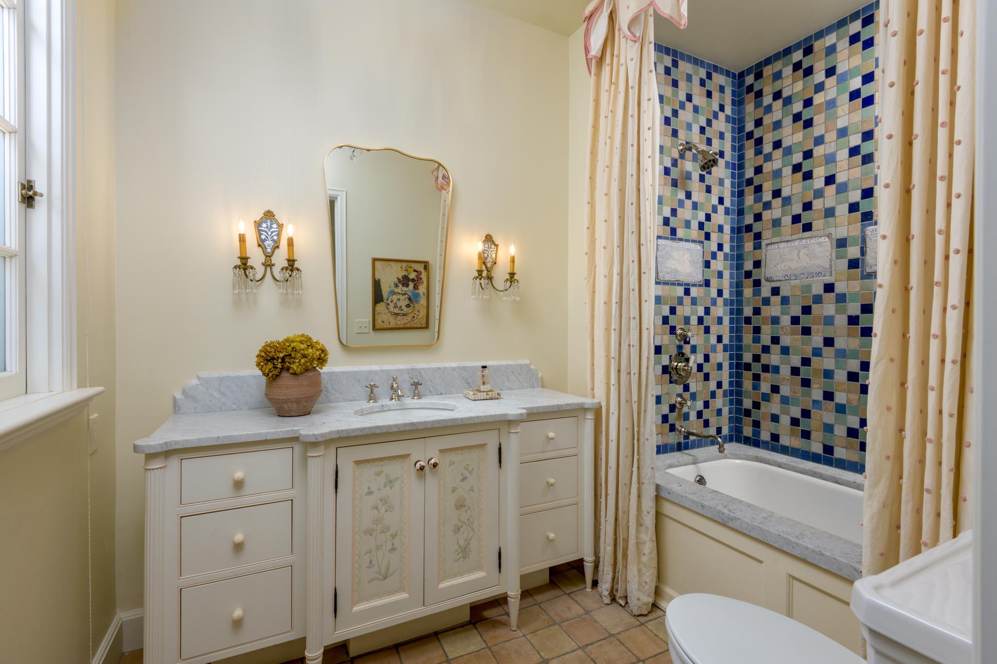 771 Garden Lane Montecito, CA 93108 - Photo 34 of 44 a bathroom with a granite countertop sink a toilet a mirror a vanity and shower