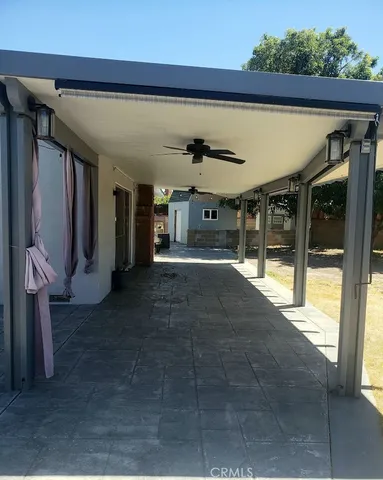 a view of a house with a large tree