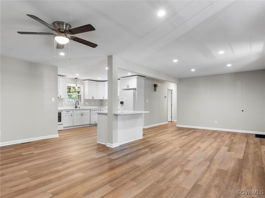 3918 Seamist Road Chester, VA 23831 - Photo 12 of 36 a view of an empty room and kitchen with wooden floor