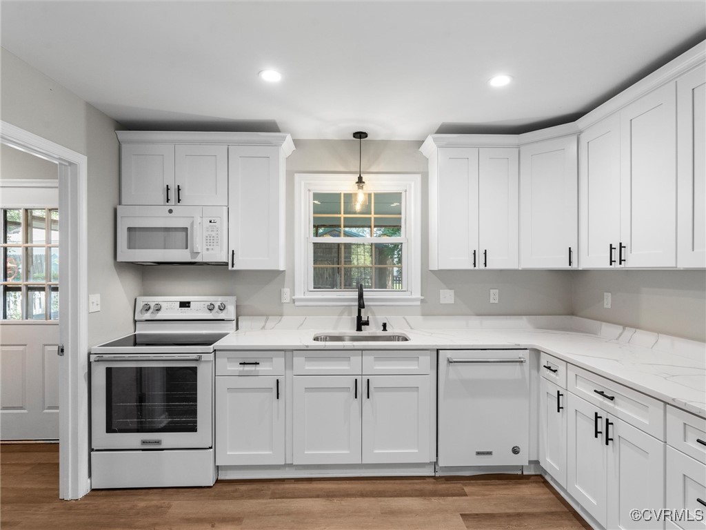 3918 Seamist Road Chester, VA 23831 - Photo 16 of 36 a kitchen with cabinets appliances a sink and a window