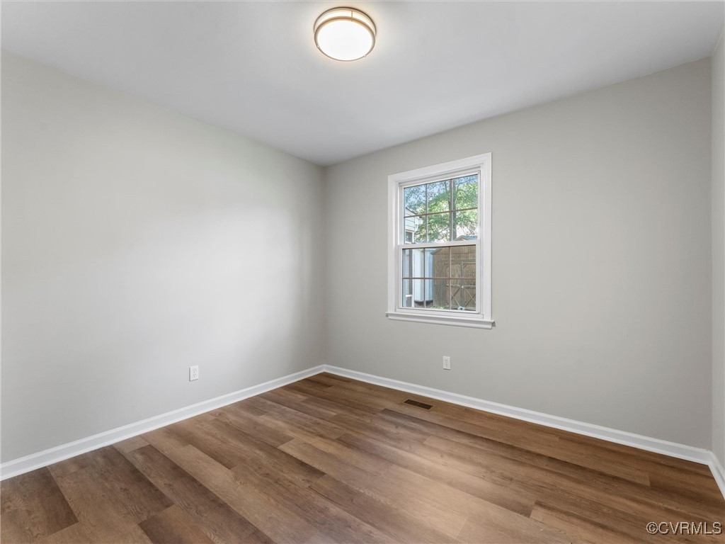 3918 Seamist Road Chester, VA 23831 - Photo 30 of 36 an empty room with wooden floor and windows