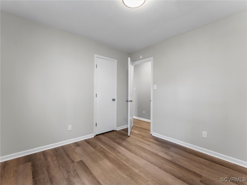3918 Seamist Road Chester, VA 23831 - Photo 32 of 36 a view of an empty room and wooden floor