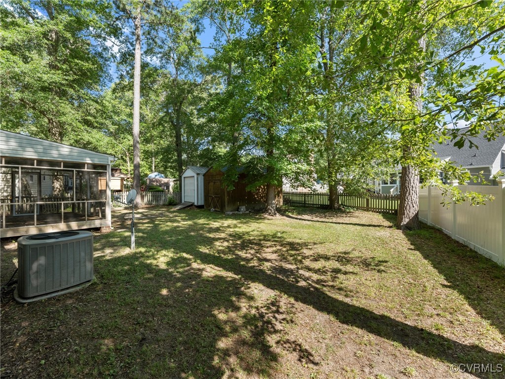 3918 Seamist Road Chester, VA 23831 - Photo 4 of 36 a view of a yard with plants and large trees