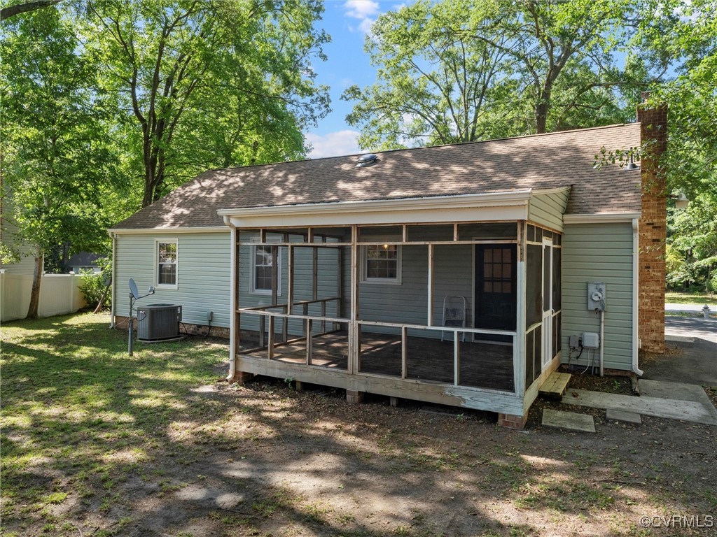 3918 Seamist Road Chester, VA 23831 - Photo 6 of 36 a view of a house with a large window and a tree