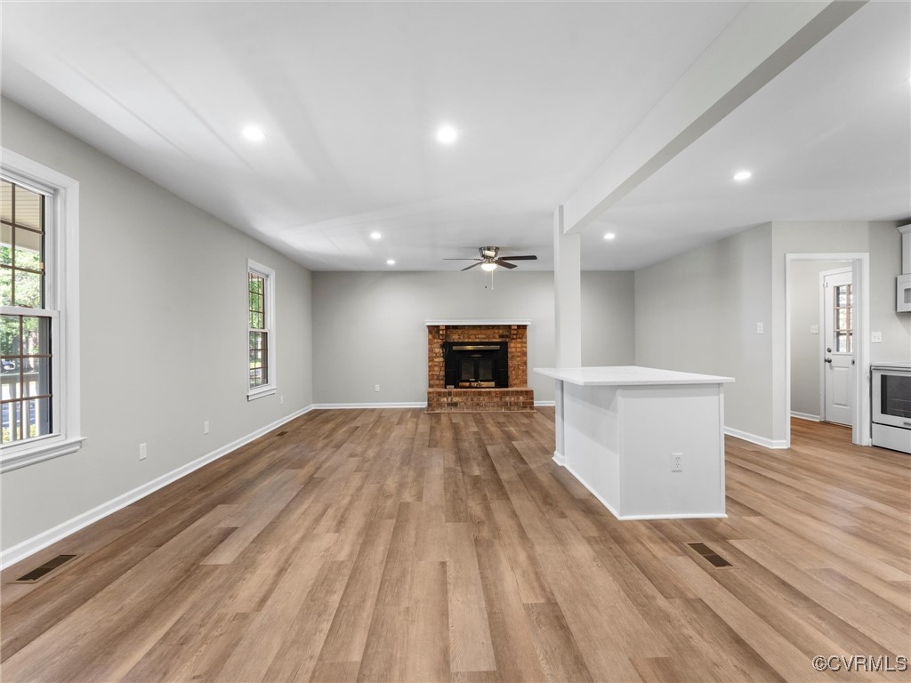 3918 Seamist Road Chester, VA 23831 - Photo 10 of 36 a view of empty room with wooden floor and fireplace