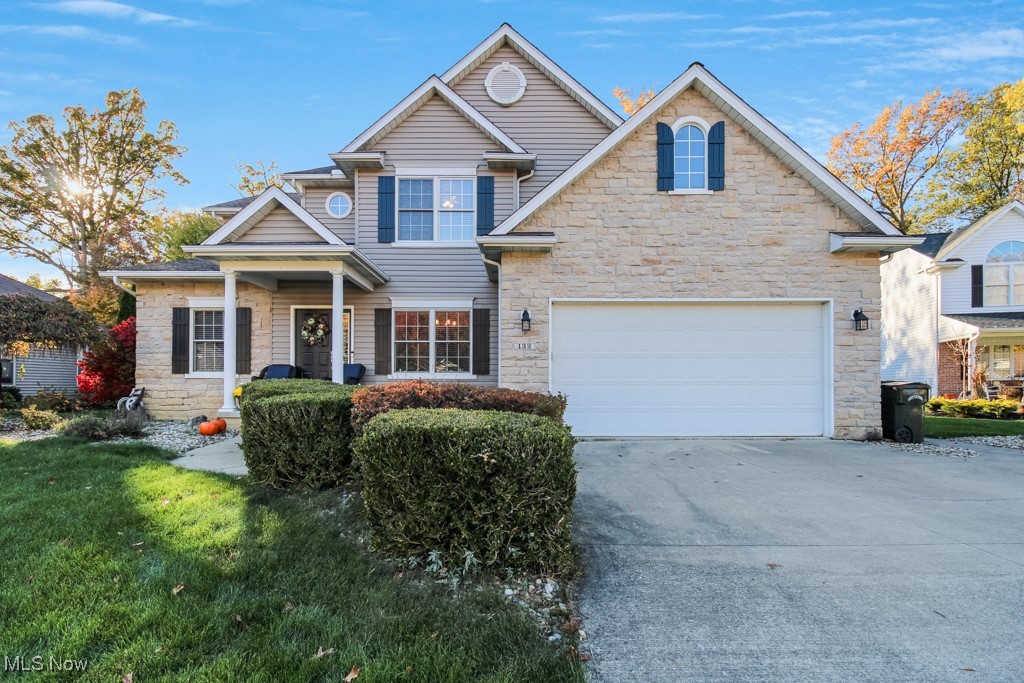 132 Timber Ridge Drive, Unit RDR Elyria, OH 44035 - Photo 1 of 41 View of front facade with a front yard and a garage