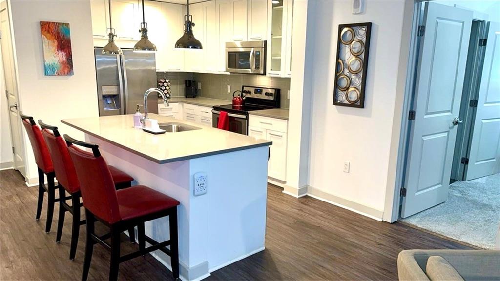 3382 Peachtree Road Northeast, Unit S12 Atlanta, GA 30326 - Photo 20 of 29 a view of a dining room with furniture and window