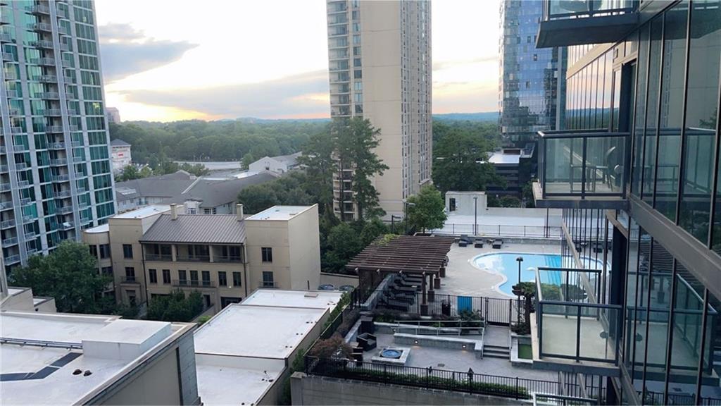 3382 Peachtree Road Northeast, Unit S12 Atlanta, GA 30326 - Photo 27 of 29 a view of a patio with table and chairs and potted plants