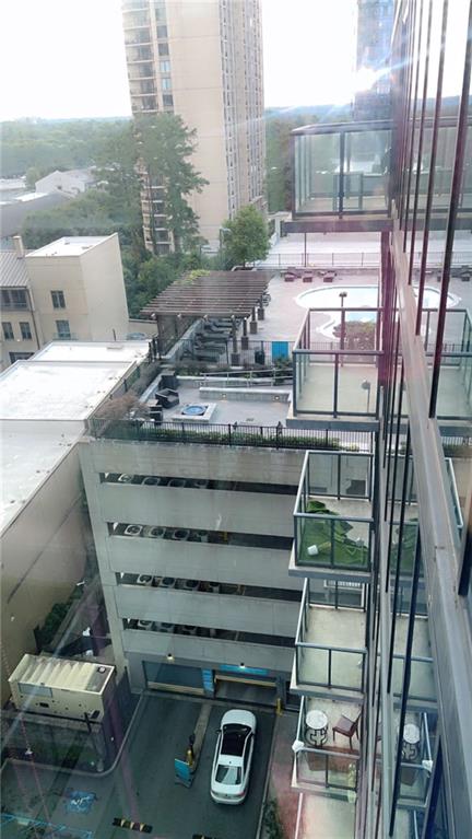 3382 Peachtree Road Northeast, Unit S12 Atlanta, GA 30326 - Photo 29 of 29 a front view of a house with a garden