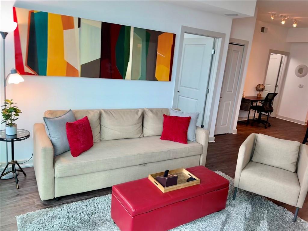 3382 Peachtree Road Northeast, Unit S12 Atlanta, GA 30326 - Photo 3 of 29 a living room with furniture and a couch