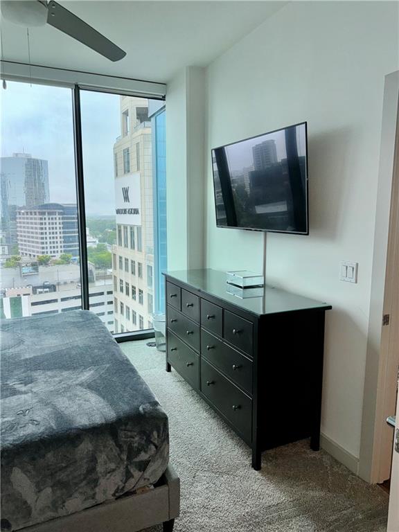 3382 Peachtree Road Northeast, Unit S12 Atlanta, GA 30326 - Photo 7 of 29 a living room with furniture and a flat screen tv