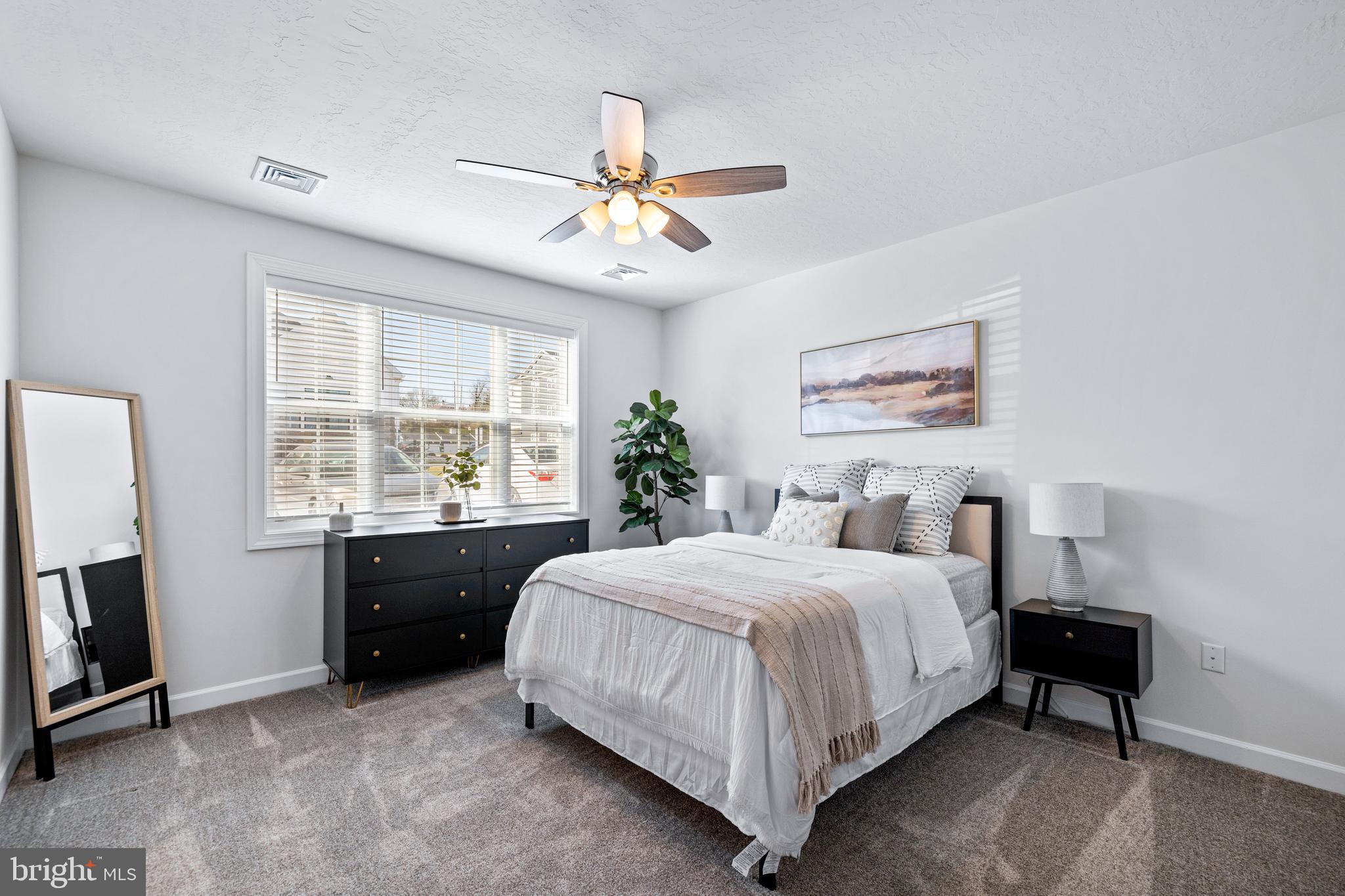 1014 Admiral Lane, Unit 116 Hanover, PA 17331 - Photo 21 of 36 a bedroom with a bed and a window