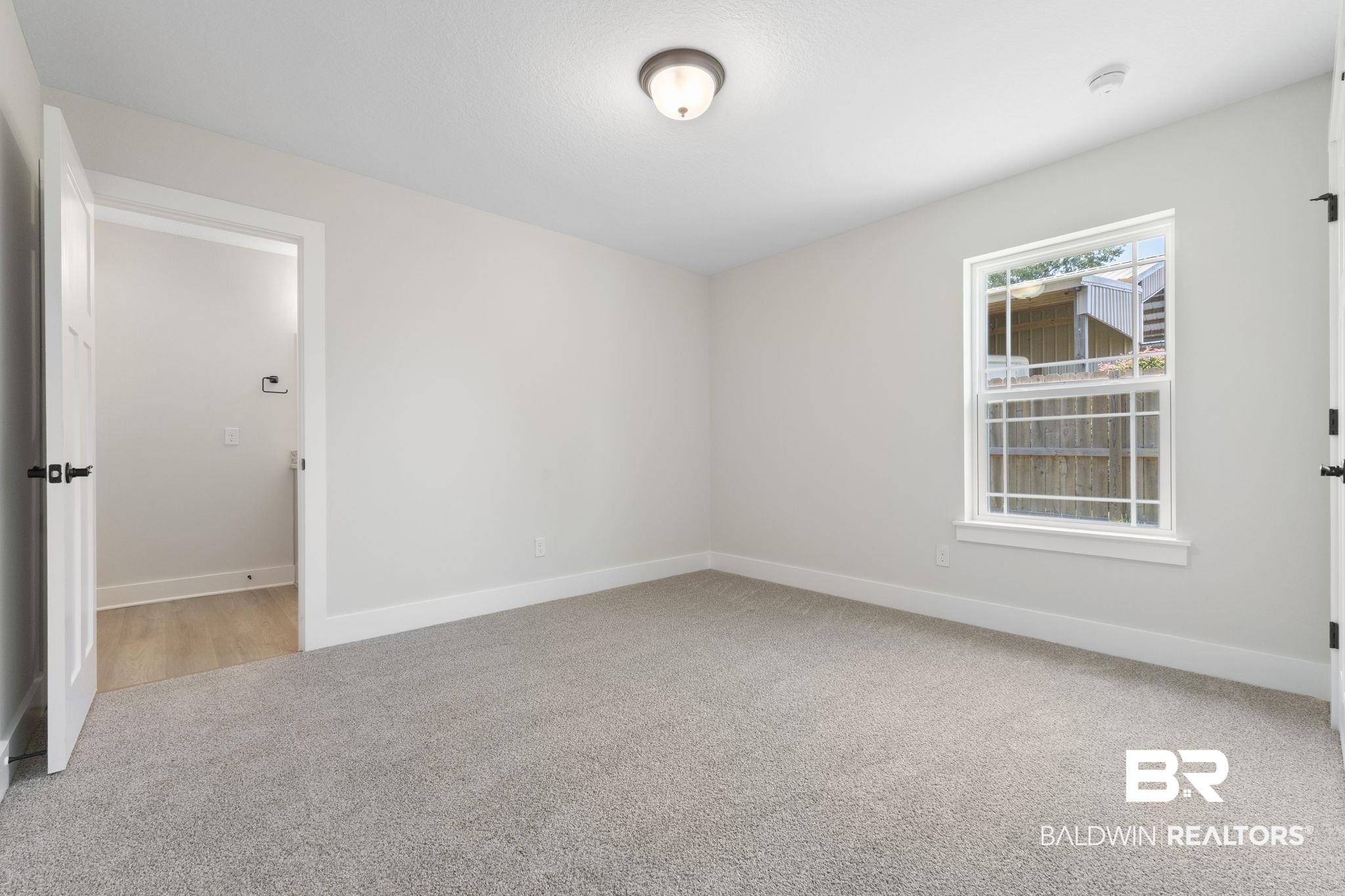 32563 Arbor Ridge Circle Lillian, AL 36549 - Photo 24 of 53 Empty room featuring light carpet