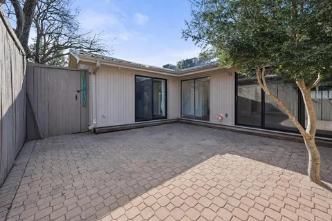 a house with trees in front of it