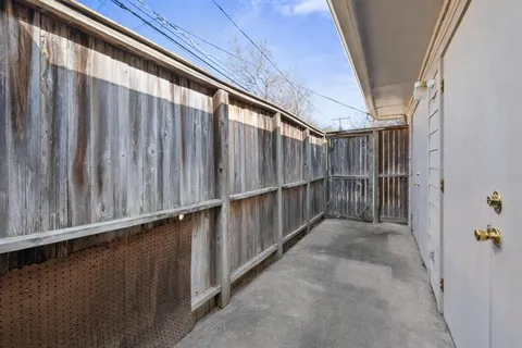 a white bath tub sitting next to a shower