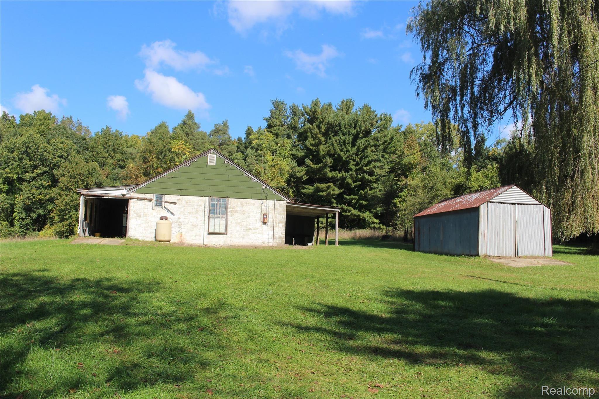 1650 West Predmore Road Oakland, MI 48363 - Photo 17 of 19 out buildings. 1 could be a garage. It has heat, electric, water. #2 is excellent storage shed.