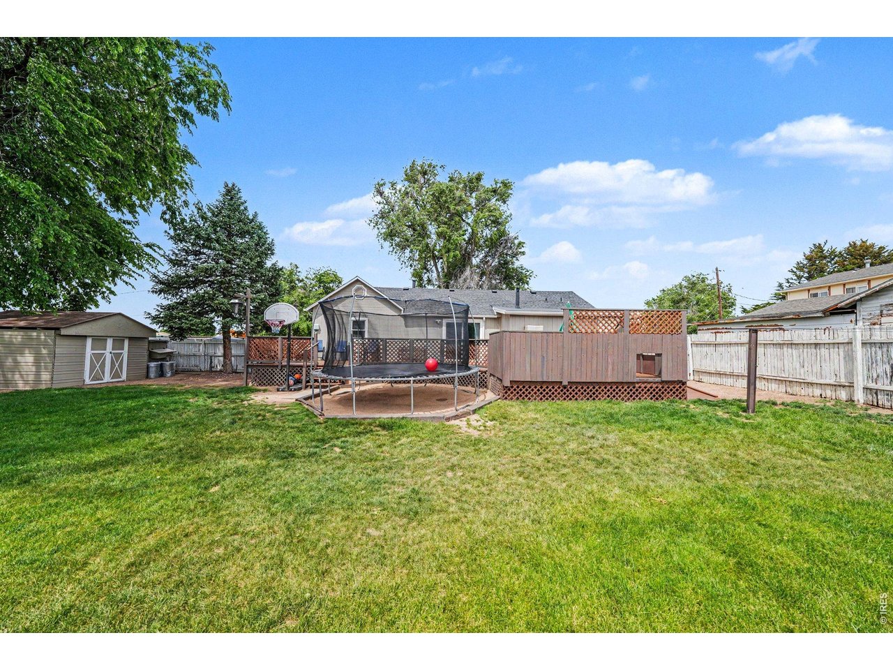 1430 30th Street Road Greeley, CO 80631 - Photo 21 of 22 a view of a house with backyard and sitting area
