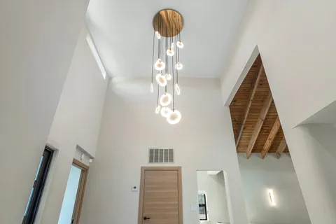 a bathroom with a glass shower door and a bathtub