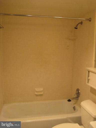 1245 4th Street Southwest, Unit E506 Washington, DC 20024 - Photo 4 of 7 a bathroom with a shower and a toilet