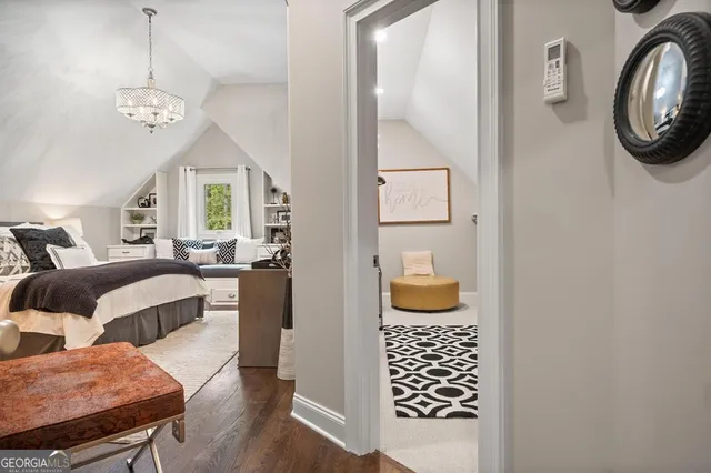 a bedroom with furniture and a window