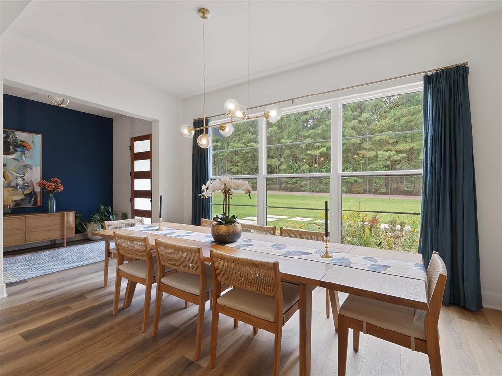 800 John Dean Road Gilmer, TX 75644 - Photo 9 of 40 a view of a dining room with furniture window and wooden floor