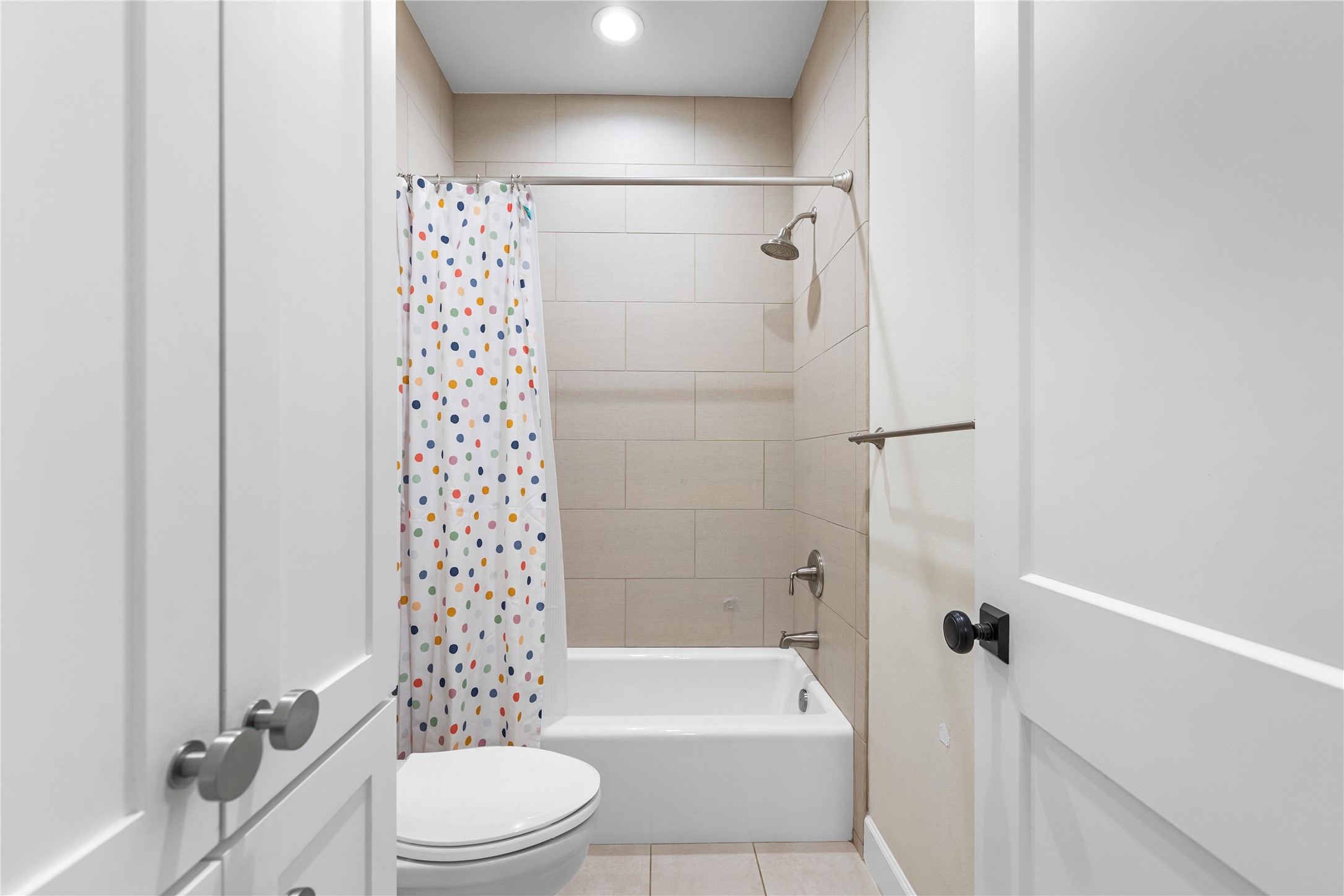 1017 Westland Ridge Road Dripping Springs, TX 78620 - Photo 18 of 40 Floor-to-ceiling large format tile highlights a clean shower and tub combination.
