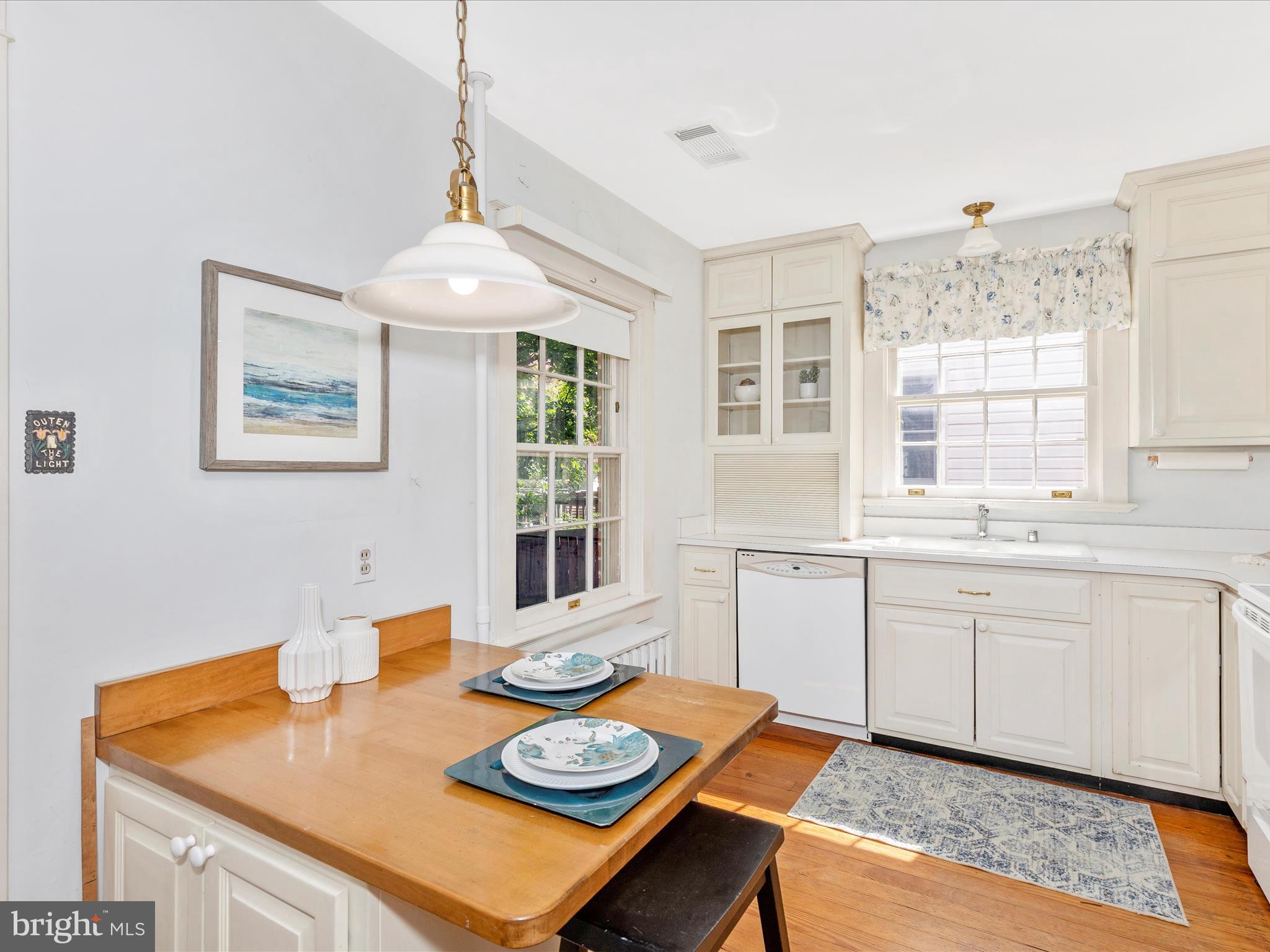 640 Wilson Place Frederick, MD 21702 - Photo 11 of 43 a open dining room with stainless steel appliances granite countertop furniture and a window