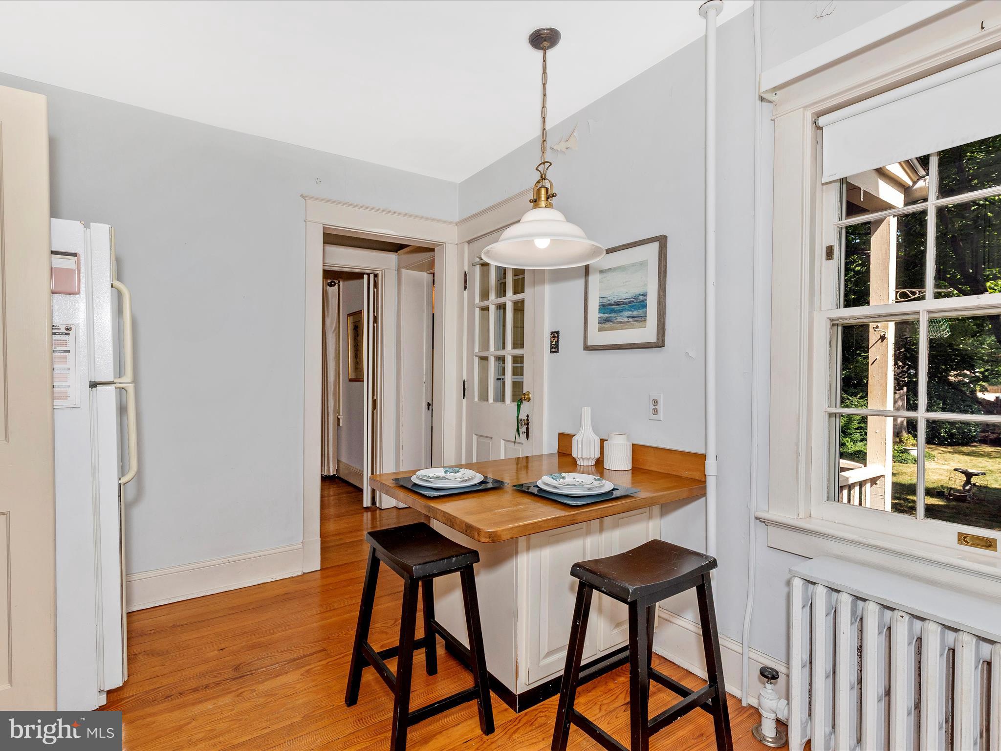 640 Wilson Place Frederick, MD 21702 - Photo 14 of 43 a view of a dining room with furniture window and wooden floor