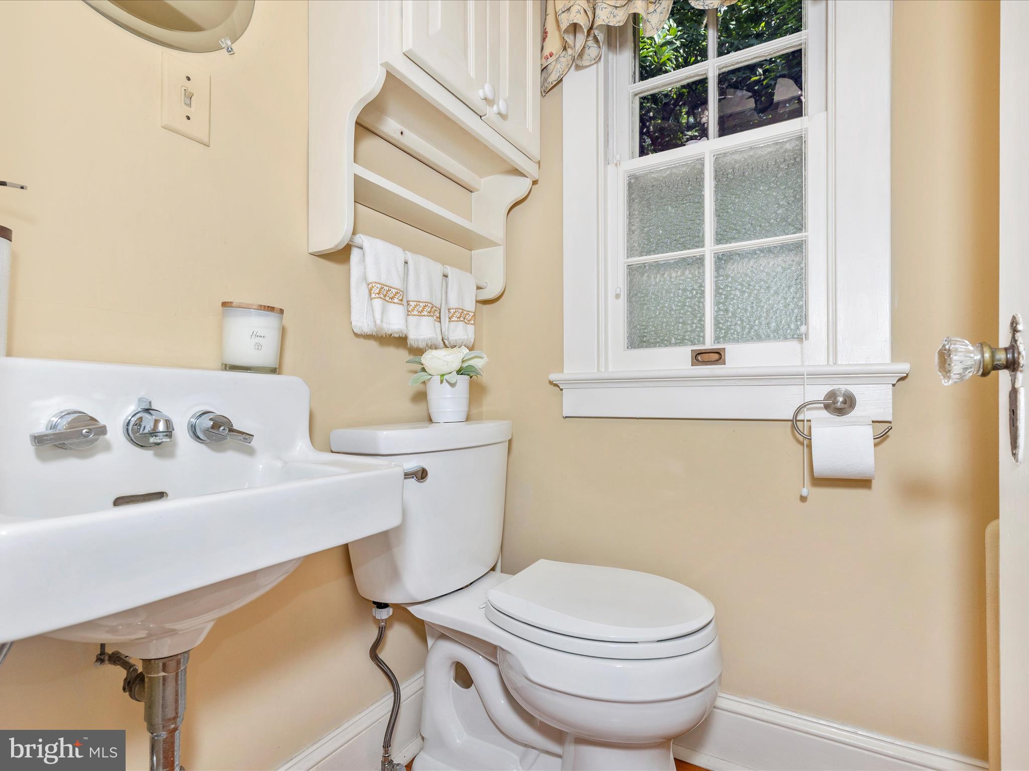 640 Wilson Place Frederick, MD 21702 - Photo 16 of 43 a bathroom with a sink a toilet and a window
