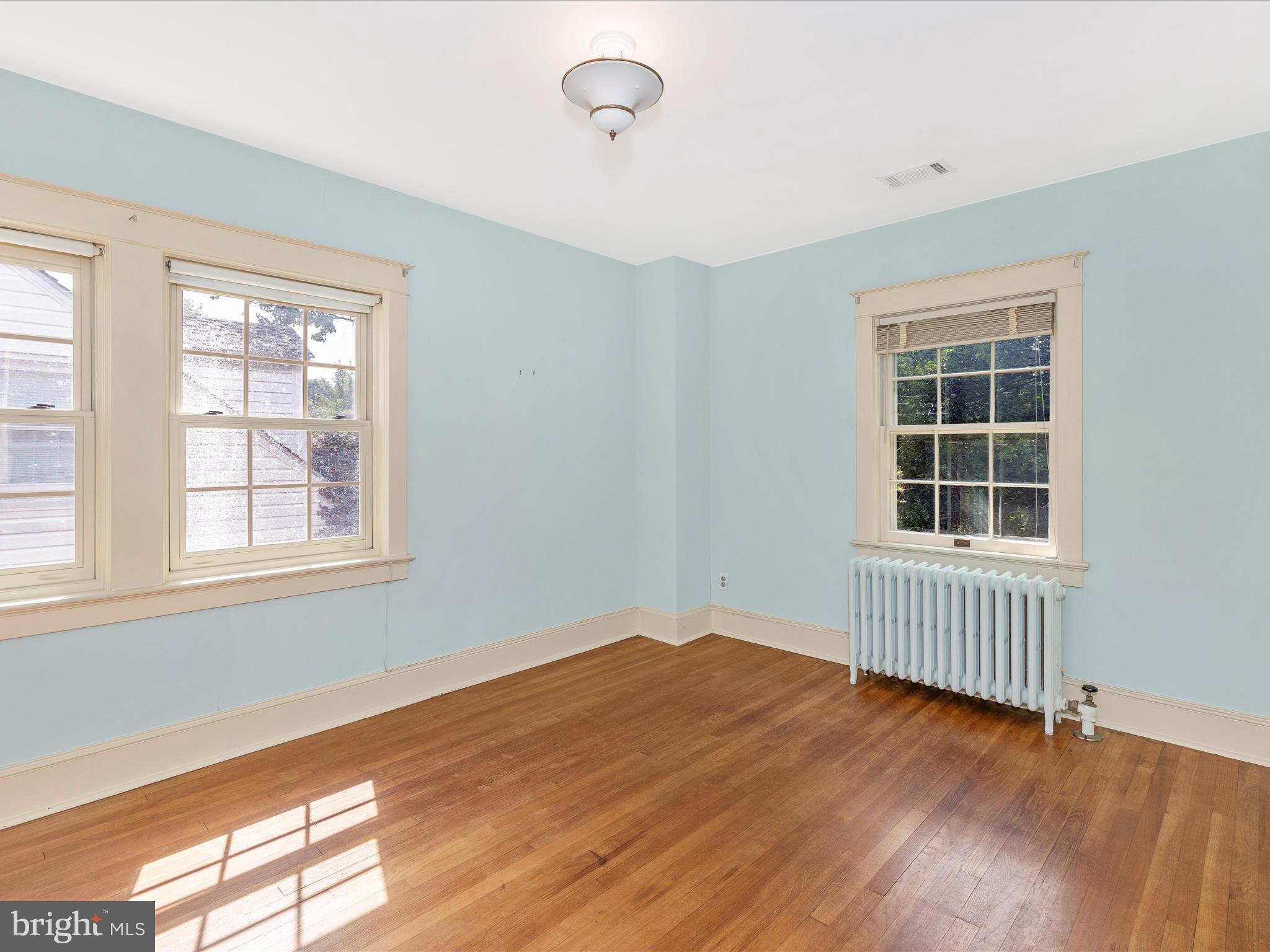 640 Wilson Place Frederick, MD 21702 - Photo 19 of 43 a view of an empty room with wooden floor and a window