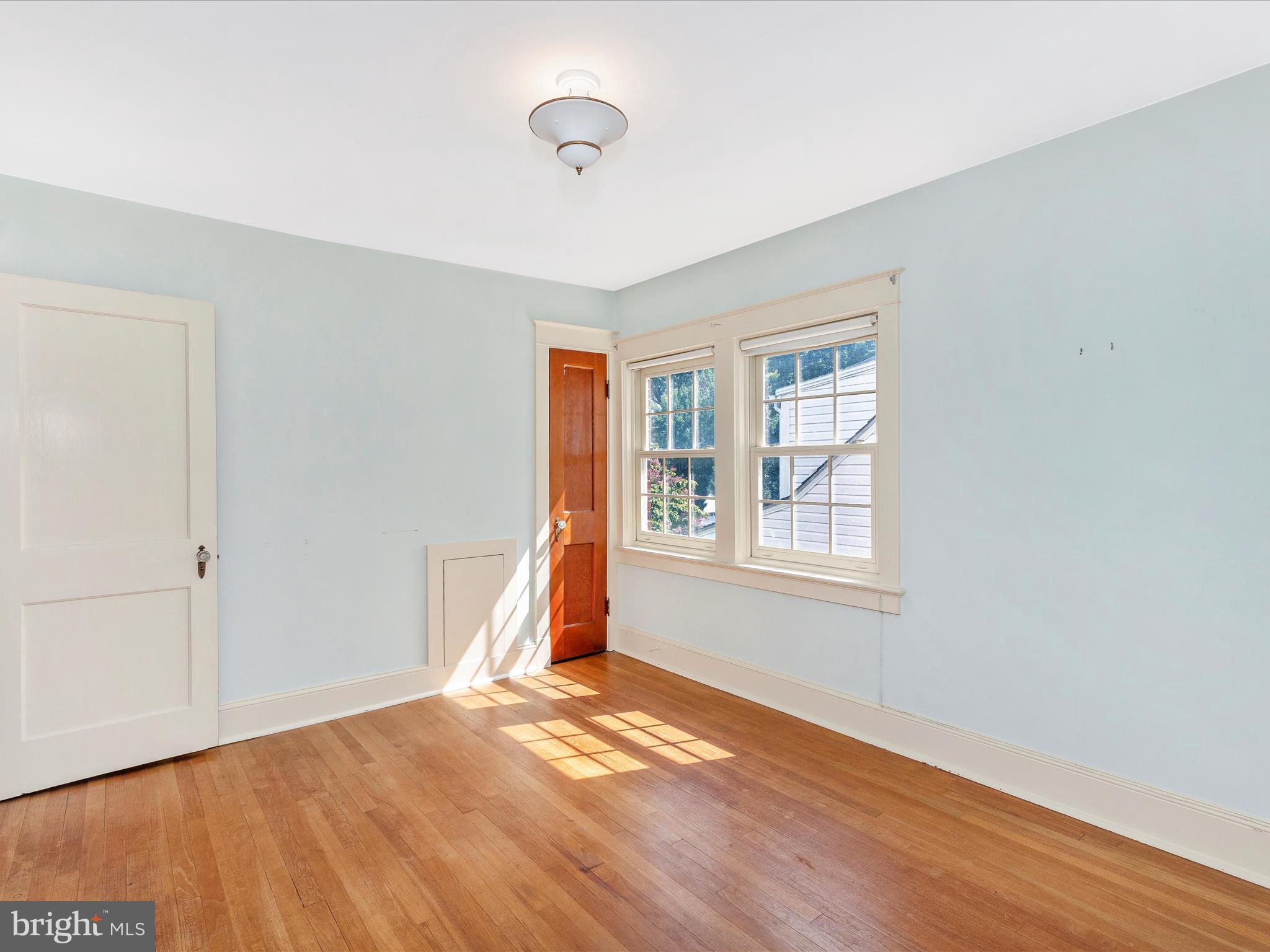 640 Wilson Place Frederick, MD 21702 - Photo 20 of 43 a view of an empty room with wooden floor and a window