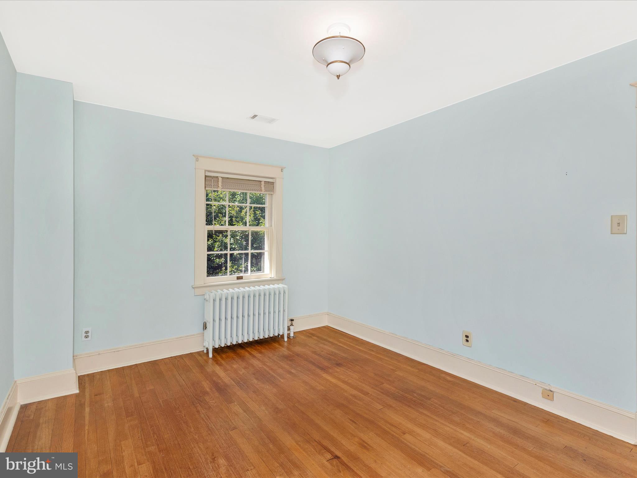 640 Wilson Place Frederick, MD 21702 - Photo 21 of 43 a view of an empty room with wooden floor and a window