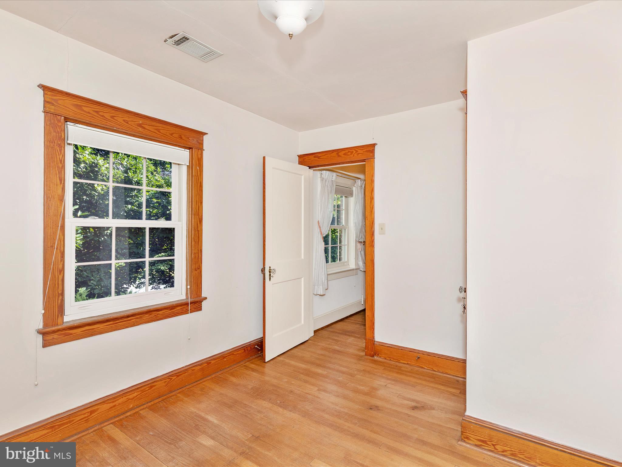640 Wilson Place Frederick, MD 21702 - Photo 26 of 43 an empty room with wooden floor and windows