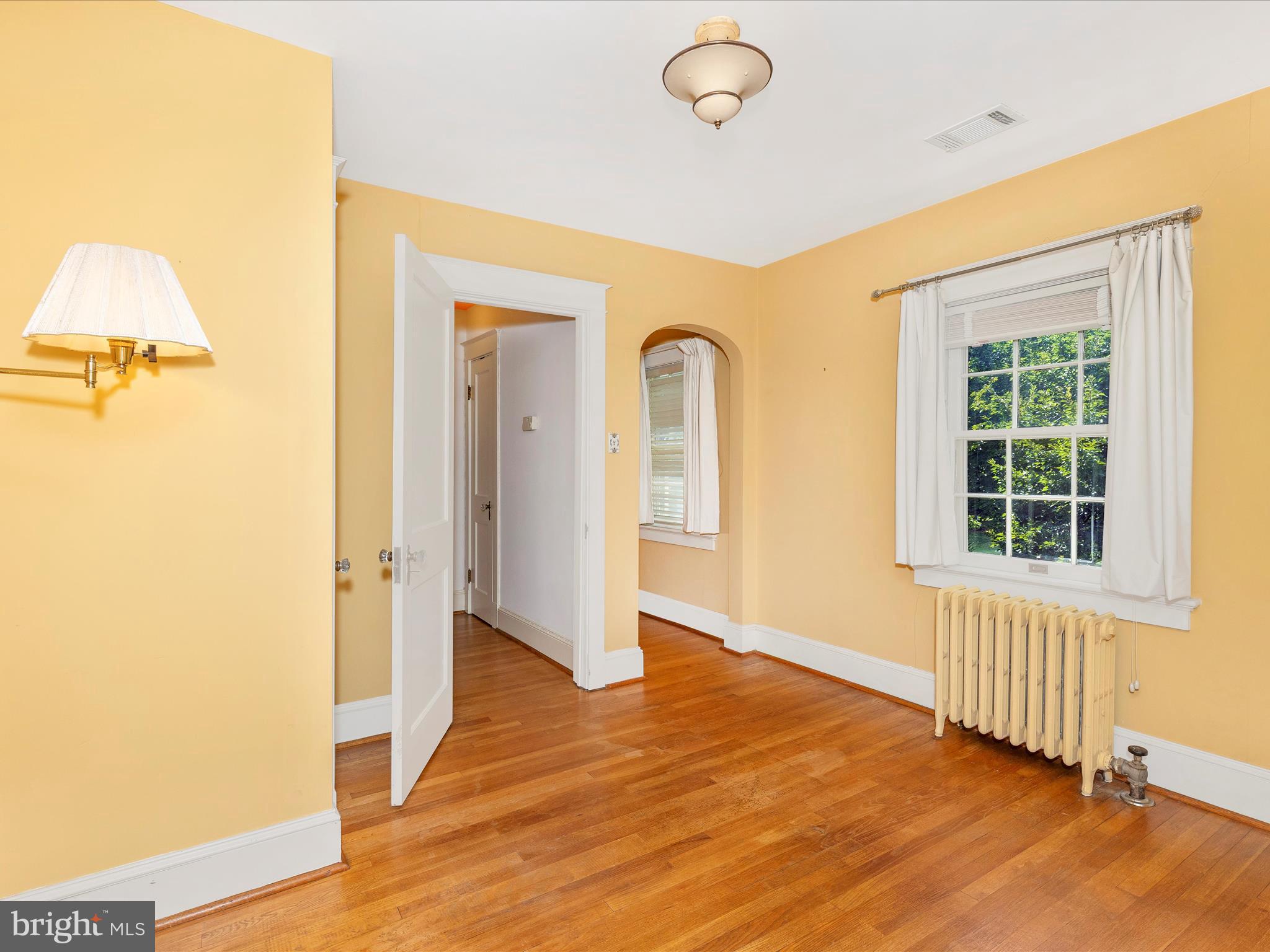 640 Wilson Place Frederick, MD 21702 - Photo 29 of 43 a view of an empty room with wooden floor and a window