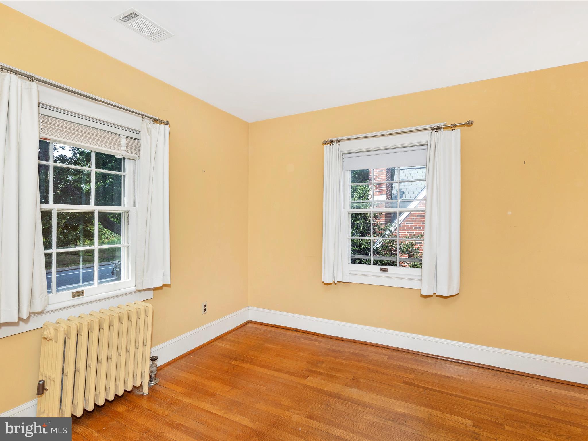 640 Wilson Place Frederick, MD 21702 - Photo 30 of 43 an empty room with wooden floor and windows