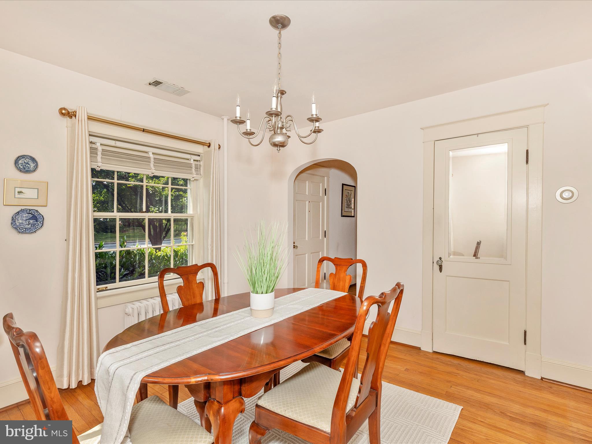 640 Wilson Place Frederick, MD 21702 - Photo 10 of 43 a dining room with furniture a chandelier and wooden floor