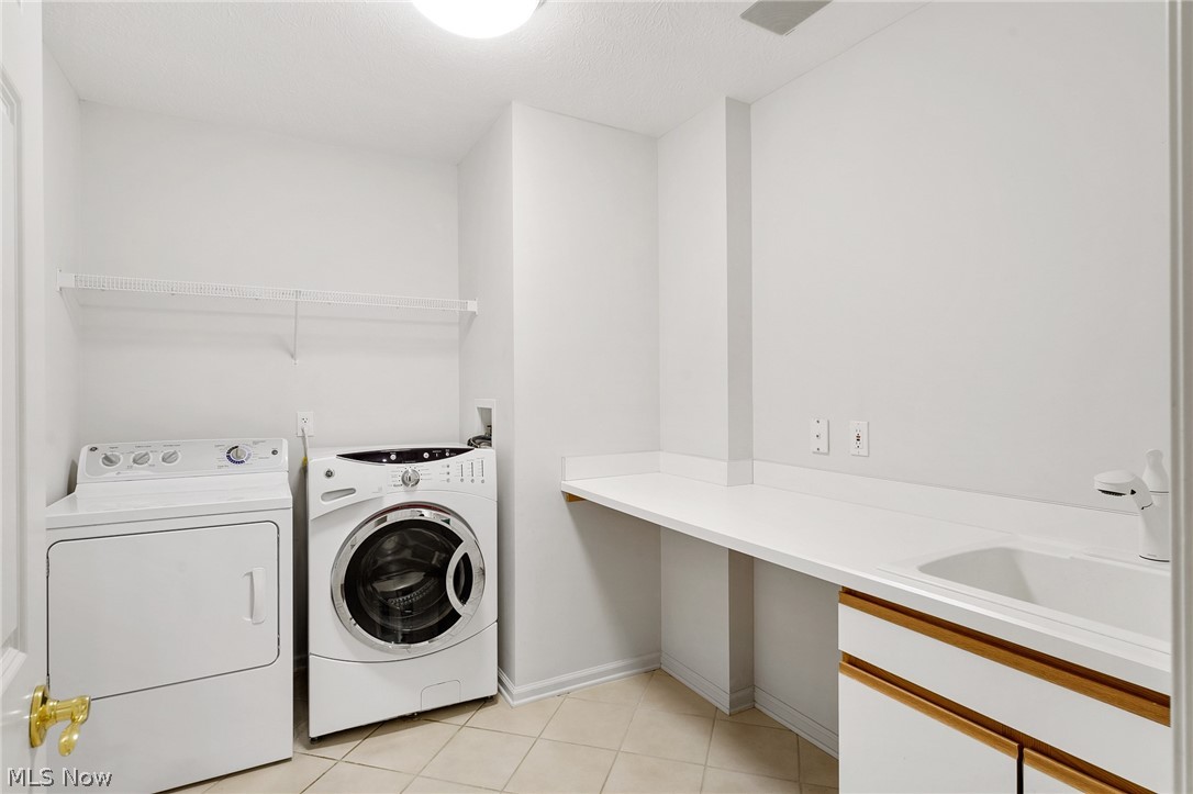 1763 Richmond Road Lyndhurst, OH 44124 - Photo 29 of 34 Plenty of folding space and cabinets for storage with wet sink