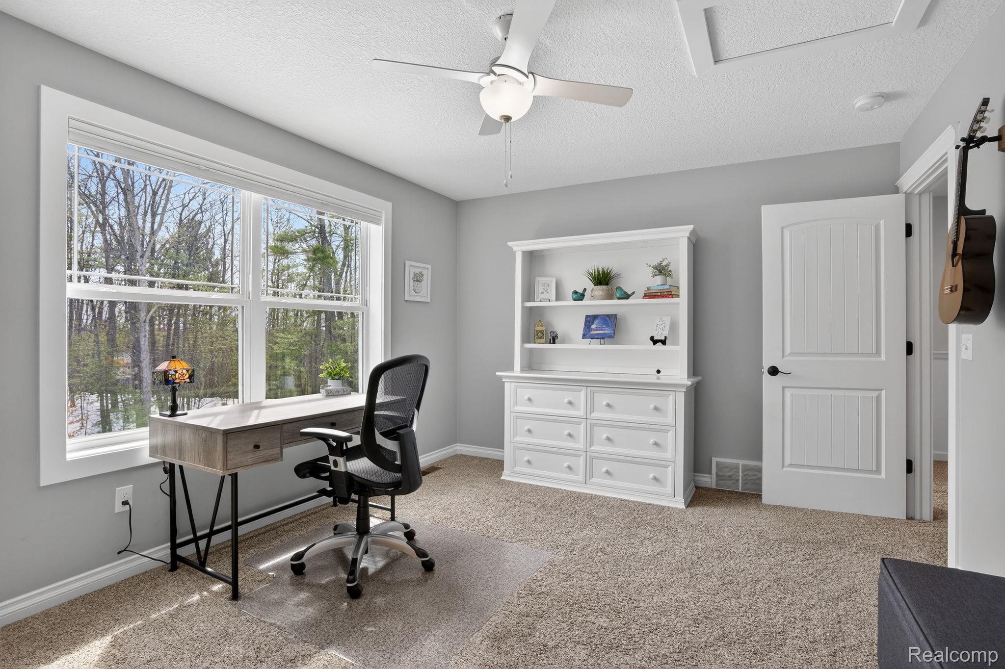 101 Highview Road Traverse City, MI 49696 - Photo 57 of 88 Office space featuring ceiling fan, a textured ceiling, and light colored carpet