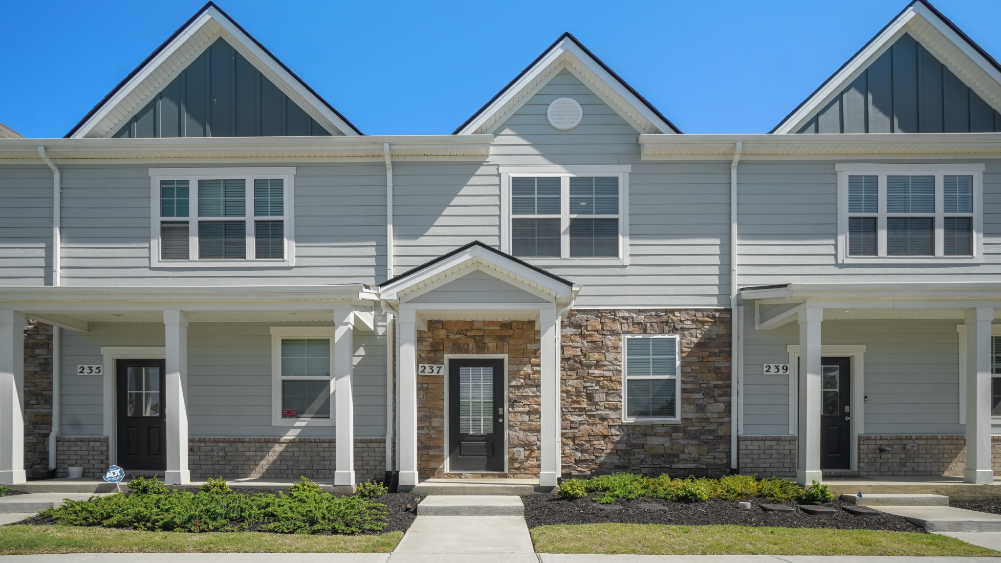 front view of a house with a yard