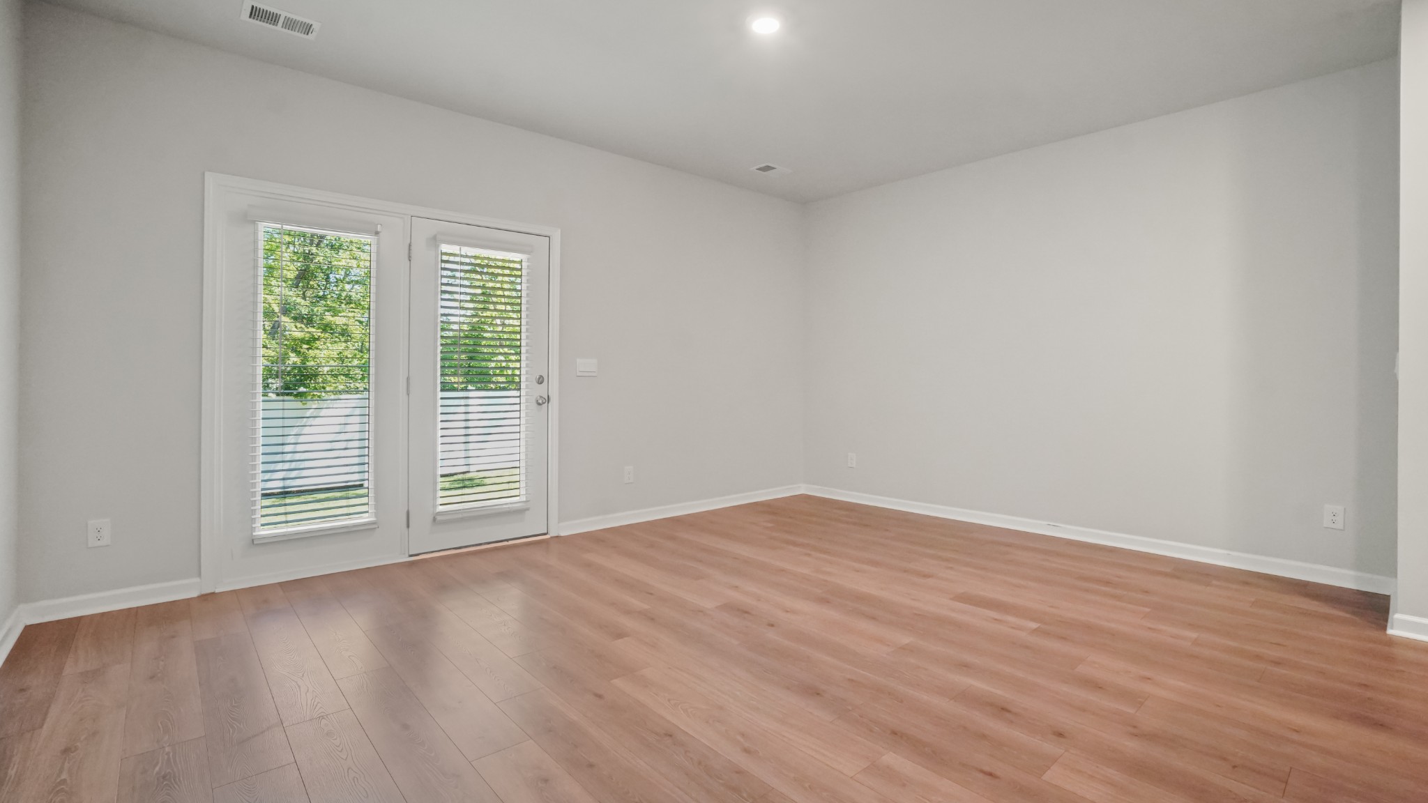 237 Catherine Lane Lebanon, TN 37087 - Photo 6 of 27 a view of an empty room with wooden floor and a window