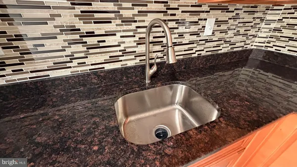 a view of kitchen sink and stove