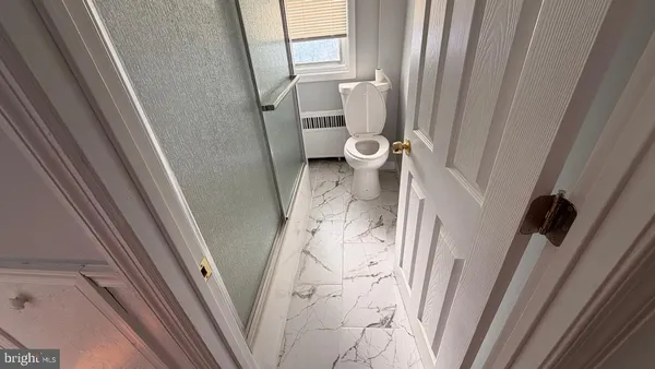 a bathroom with a sink and toilet