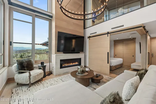 a bedroom with furniture and a fireplace