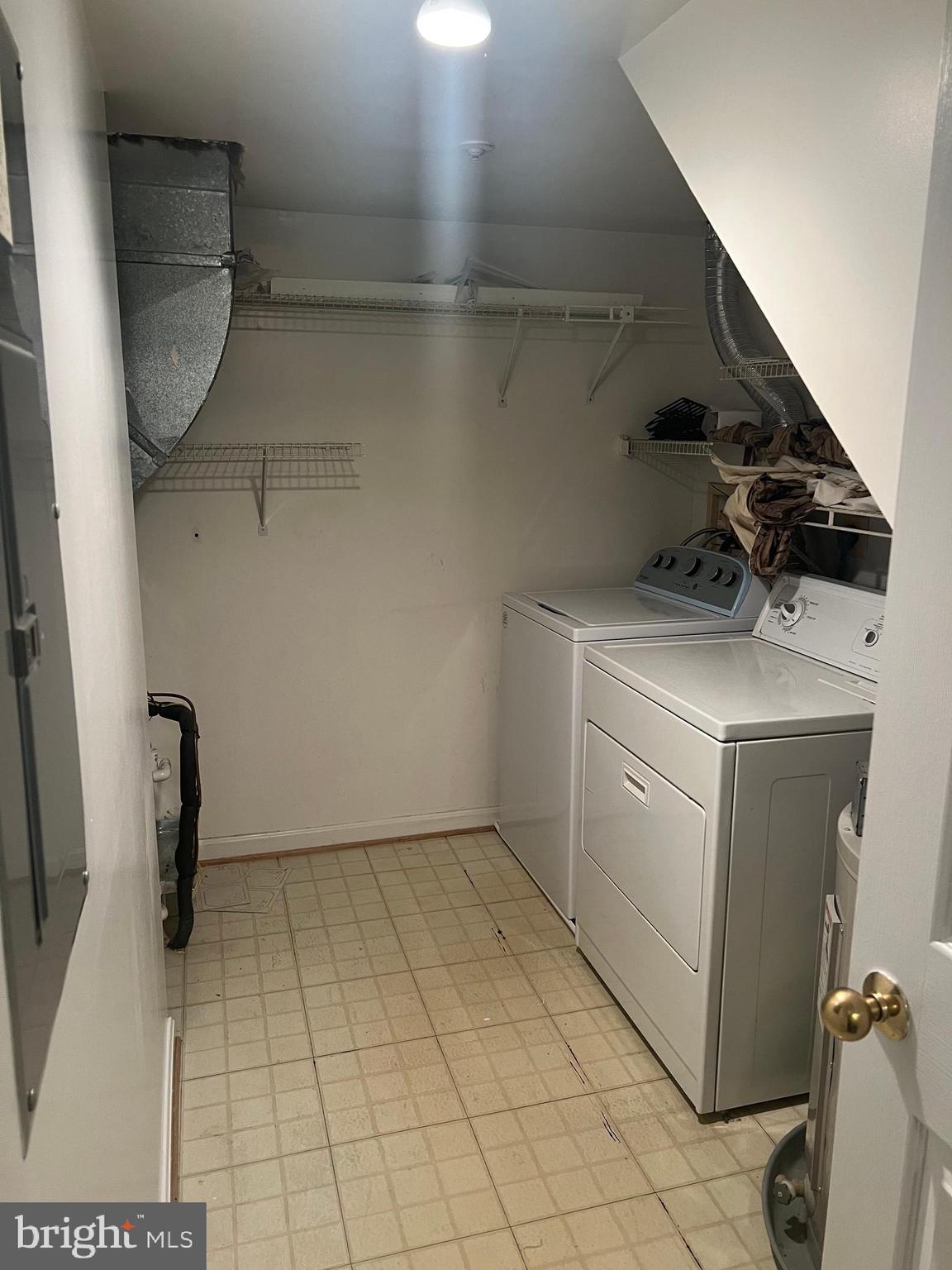 19086 Highstream Drive, Unit 766 Germantown, MD 20874 - Photo 13 of 21 a utility room with dryer and washer