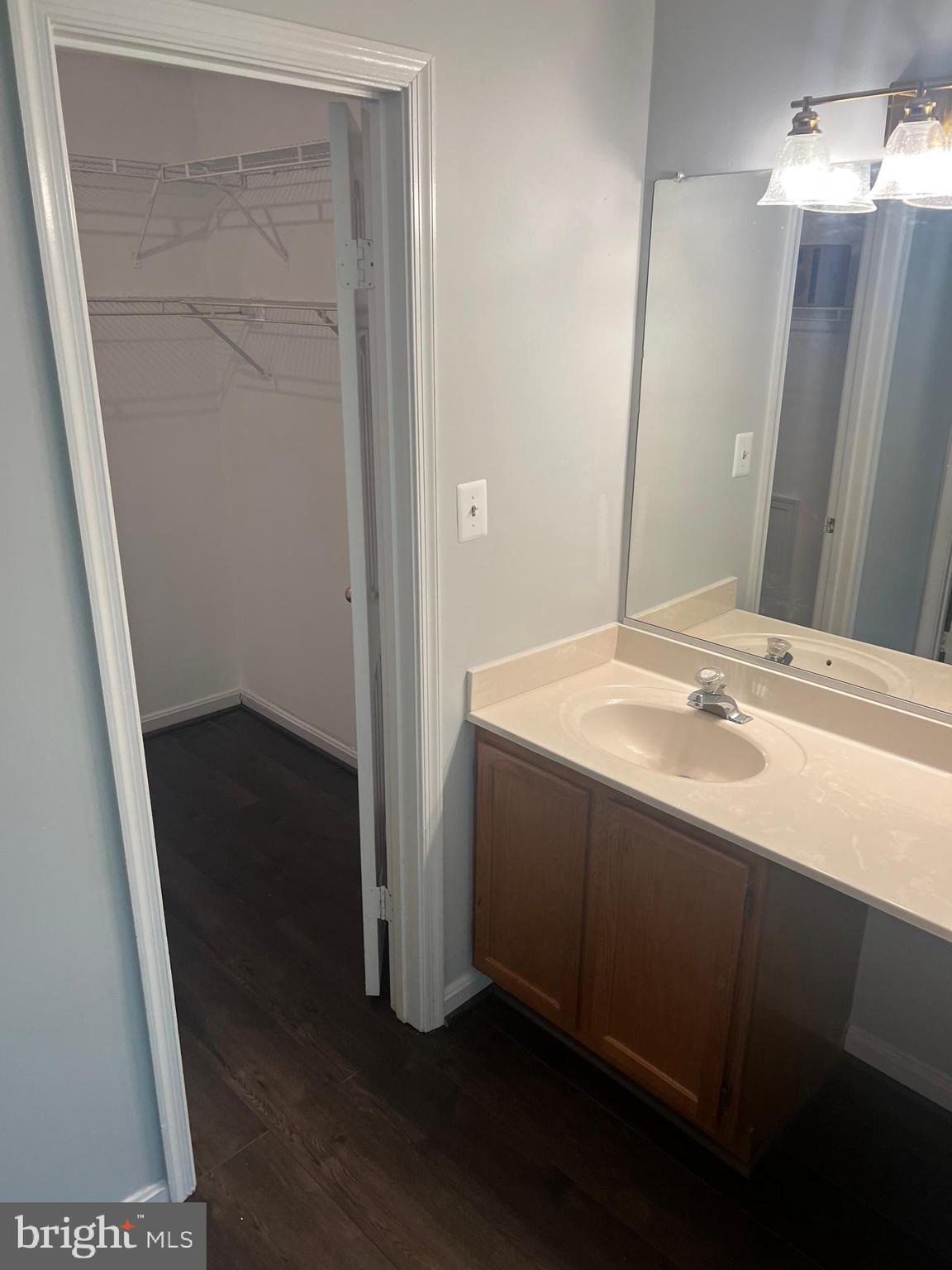 19086 Highstream Drive, Unit 766 Germantown, MD 20874 - Photo 16 of 21 a bathroom with a sink and a mirror