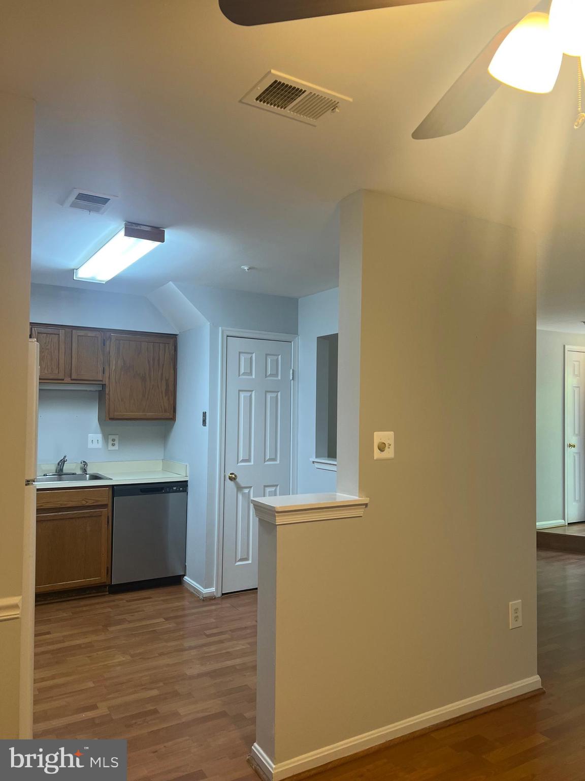 19086 Highstream Drive, Unit 766 Germantown, MD 20874 - Photo 7 of 21 a view of a kitchen with a sink and a refrigerator