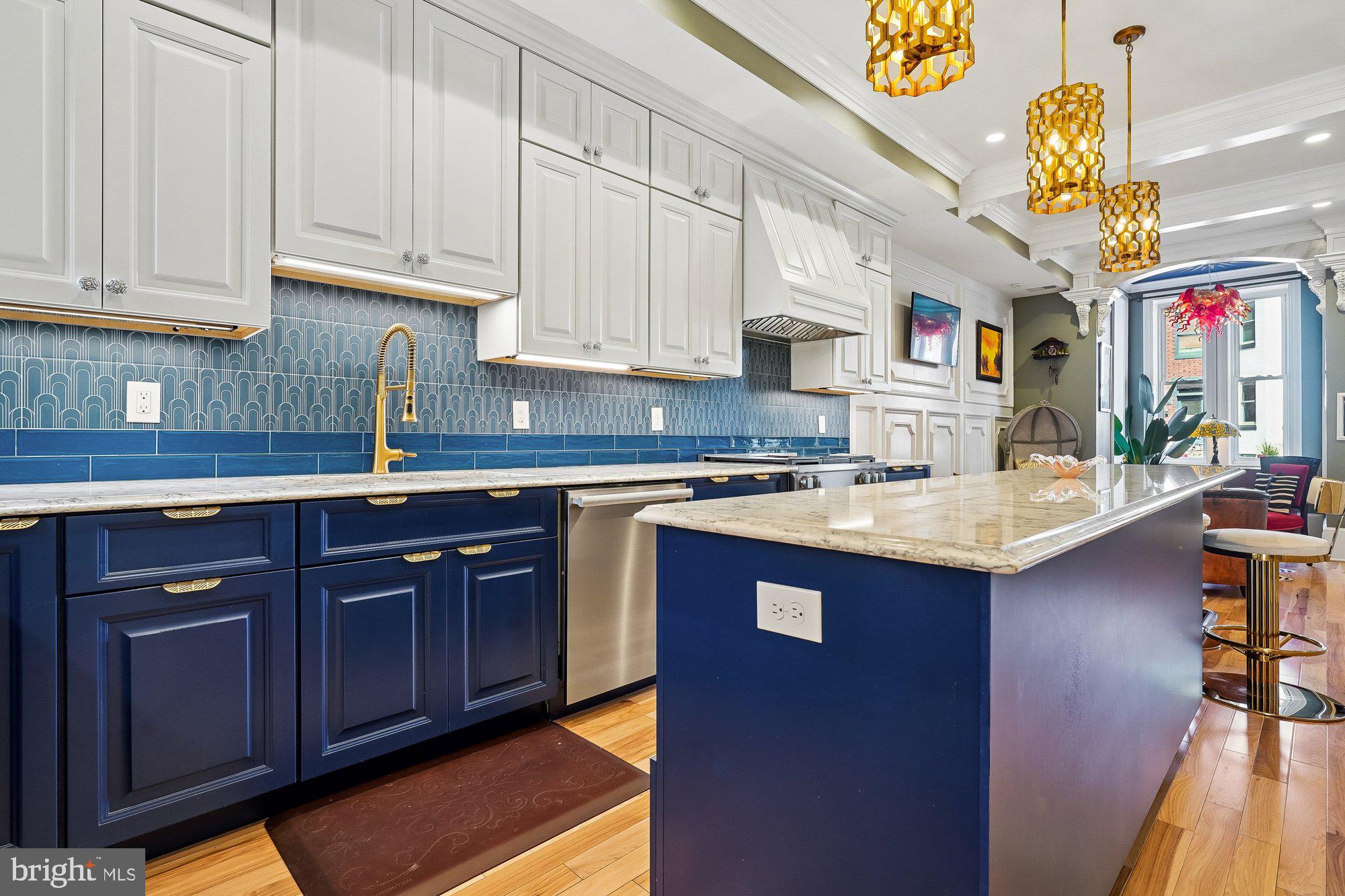 909 C Street Northeast Washington, DC 20002 - Photo 13 of 43 a kitchen with stainless steel appliances granite countertop a sink stove and cabinets