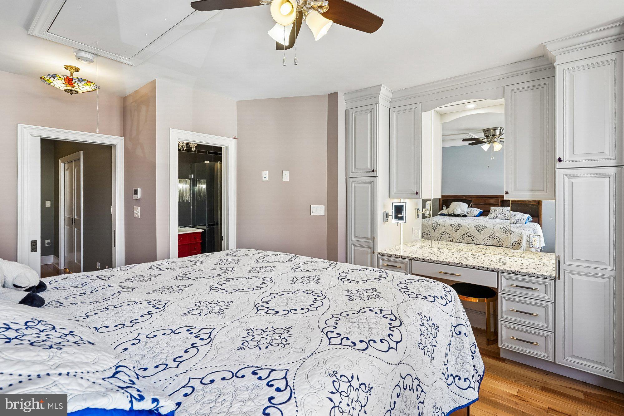 909 C Street Northeast Washington, DC 20002 - Photo 21 of 43 a bedroom with a bed and a dresser